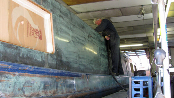 Paul (the painter, not me) busy working on the roof, with the sides taken back to bare metal