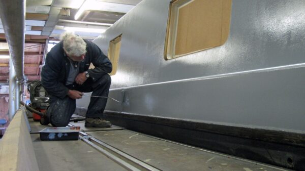 Paul (the painter) applying the primer
