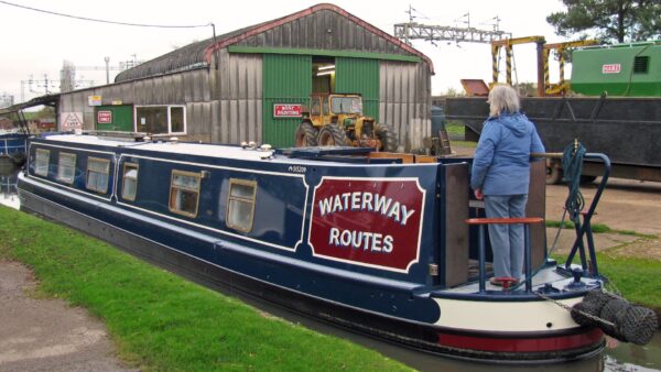 Repainted Waterway Routes Narrowboat leaving Rose Narrowboats